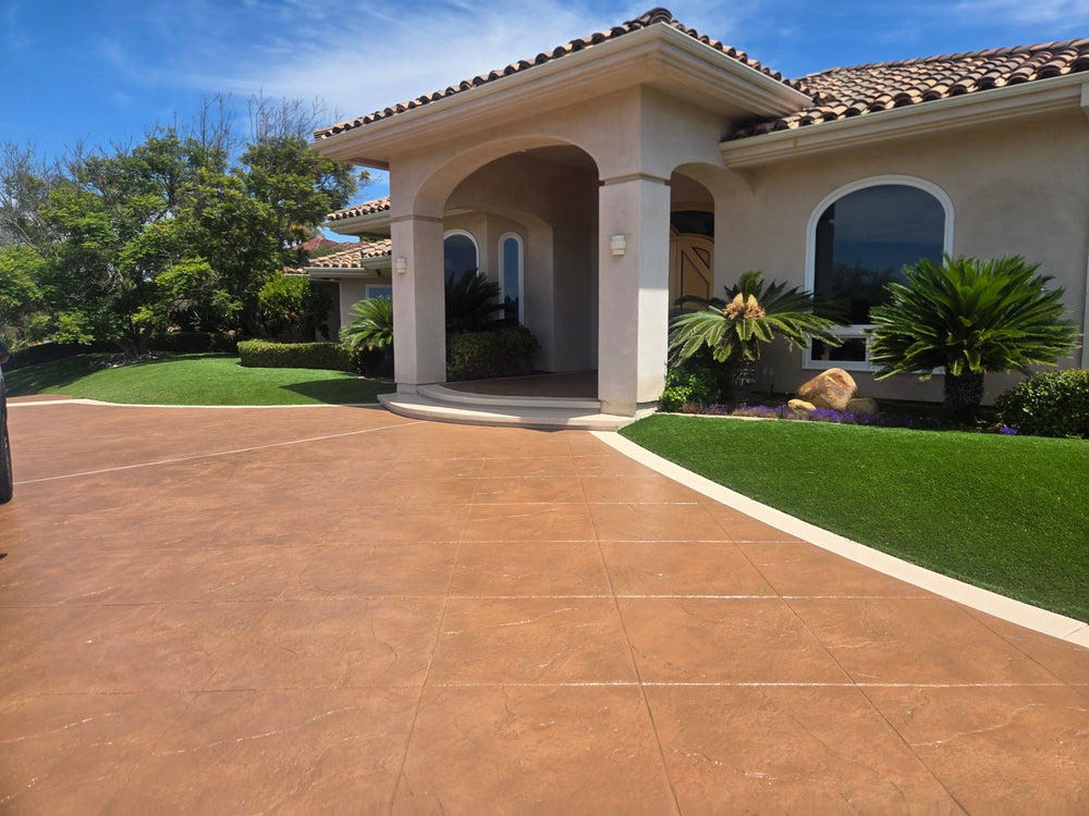 Real exterior entry project using a blend that includes Smith's Dark Adobe stain; warm terracotta tones on textured concrete.